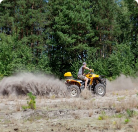 man-riding-yellow-quad-atv-all-terrain-vehicle-sandy-forest-extreme-sport-motion-adventure-tourist-attraction_130265-2920